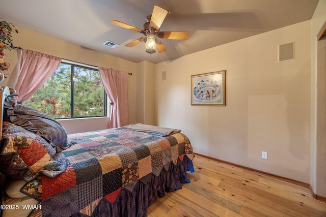 2353 Florian Meadow Trl, Overgaard, AZ 85933 - bedroom with light wood finished floors and a ceiling fan