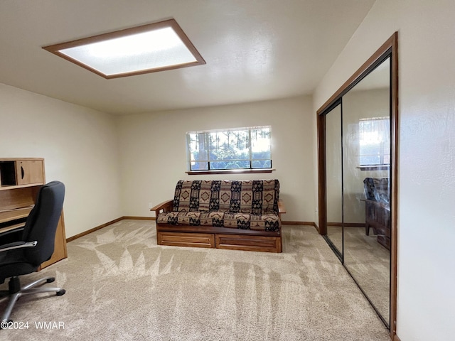 office area featuring light colored carpet and baseboards