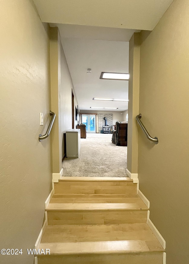 staircase with carpet flooring and baseboards