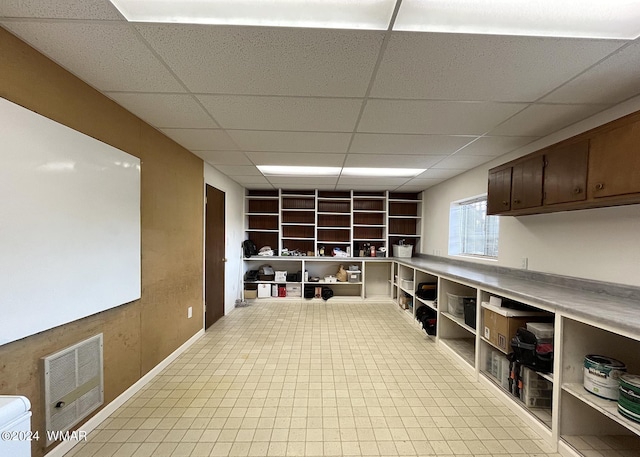 interior space featuring a drop ceiling and visible vents