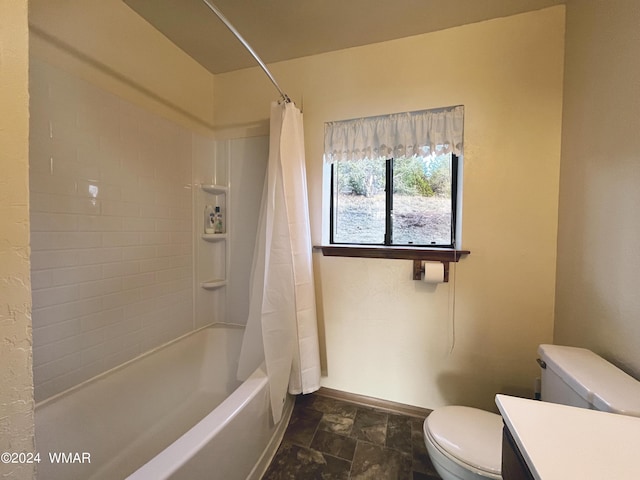 full bath with shower / bath combination with curtain, toilet, stone finish flooring, vanity, and baseboards