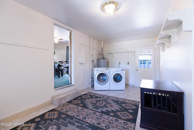 839 S 3rd St, Snowflake, AZ 85937 - washroom with independent washer and dryer, water heater, tile patterned flooring, and baseboards