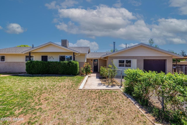 839 S 3rd St, Snowflake, AZ 85937 - ranch-style home with an attached garage, a front lawn, and central air condition unit