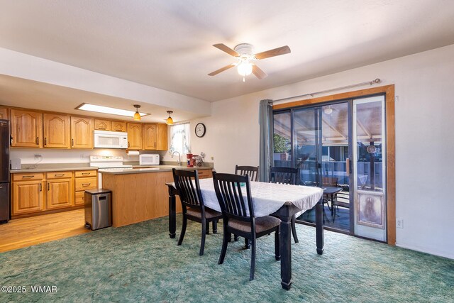 839 S 3rd St, Snowflake, AZ 85937 - dining room with a ceiling fan and light carpet