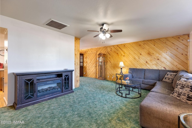 839 S 3rd St, Snowflake, AZ 85937 - carpeted living area featuring ceiling fan and wood walls