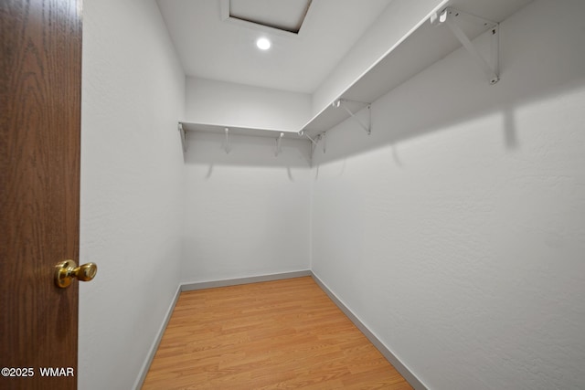 202 700th St W, Taylor, AZ 85939 - walk in closet featuring attic access and light wood finished floors