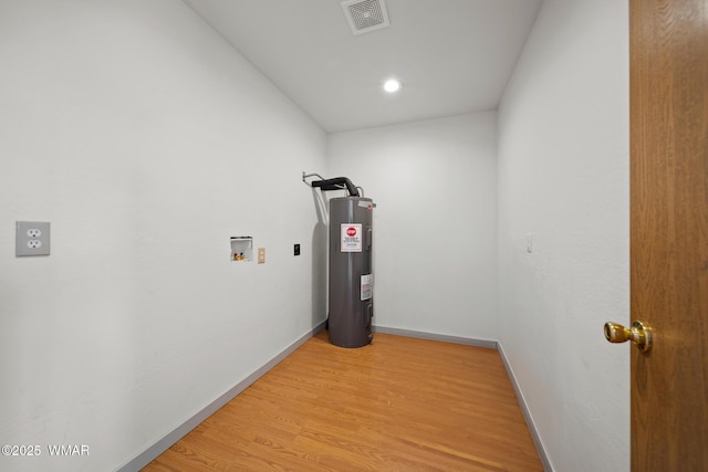 202 700th St W, Taylor, AZ 85939 - hallway with water heater, light wood-type flooring, baseboards, and recessed lighting