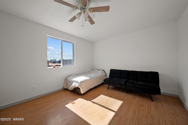 202 700th St W, Taylor, AZ 85939 - bedroom with wood finished floors, baseboards, and ceiling fan