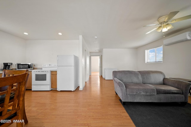 202 700th St W, Taylor, AZ 85939 - kitchen featuring white appliances, a wall unit AC, open floor plan, light wood finished floors, and a ceiling fan