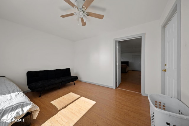 202 700th St W, Taylor, AZ 85939 - living area with light wood-style flooring, a ceiling fan, and baseboards
