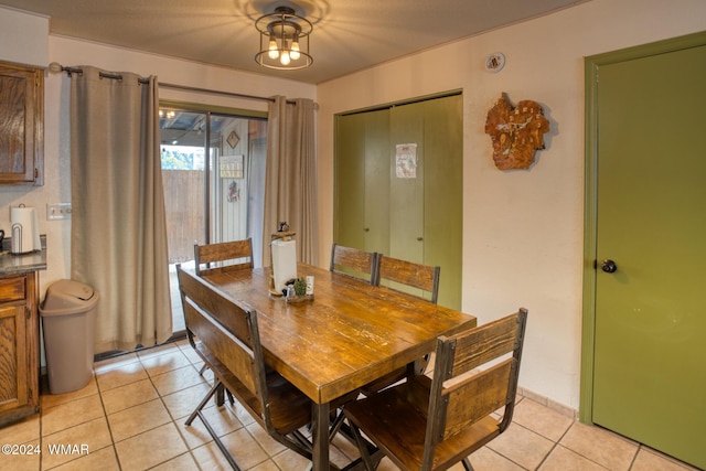 dining area featuring light tile patterned flooring