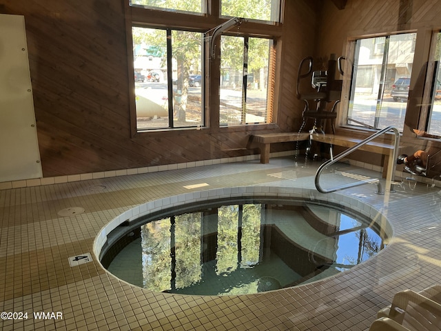 view of pool with an indoor in ground hot tub