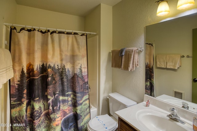 full bath featuring a textured wall, toilet, vanity, visible vents, and shower / bath combo with shower curtain