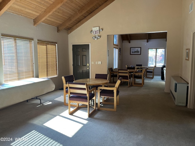 carpeted dining area with high vaulted ceiling, wooden ceiling, and beam ceiling