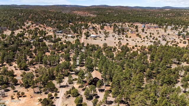 746 Jacks Wild Rd, Show Low, AZ 85901 - drone / aerial view featuring a mountain view and a wooded view
