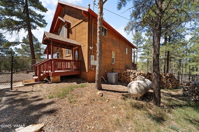 746 Jacks Wild Rd, Show Low, AZ 85901 - view of side of property with a deck, fence, and central AC unit