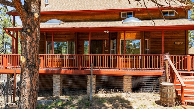 746 Jacks Wild Rd, Show Low, AZ 85901 - back of house featuring covered porch and a shingled roof