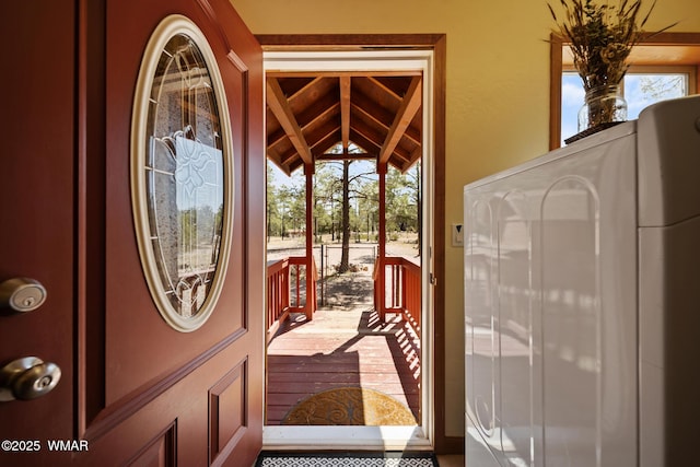 746 Jacks Wild Rd, Show Low, AZ 85901 - doorway with plenty of natural light, washer / dryer, and vaulted ceiling