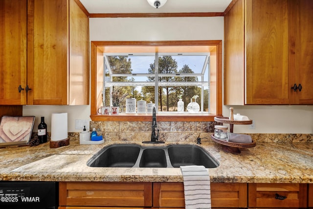746 Jacks Wild Rd, Show Low, AZ 85901 - kitchen featuring a sink, light stone countertops, black dishwasher, and brown cabinetry