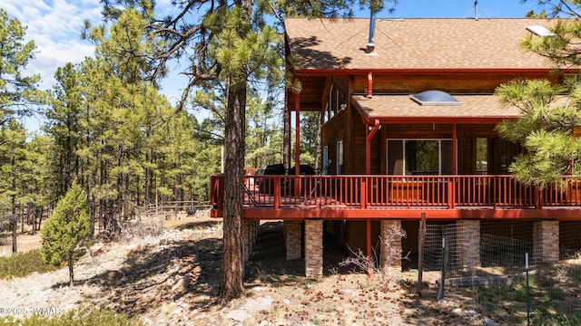 746 Jacks Wild Rd, Show Low, AZ 85901 - rear view of house with a shingled roof and a deck