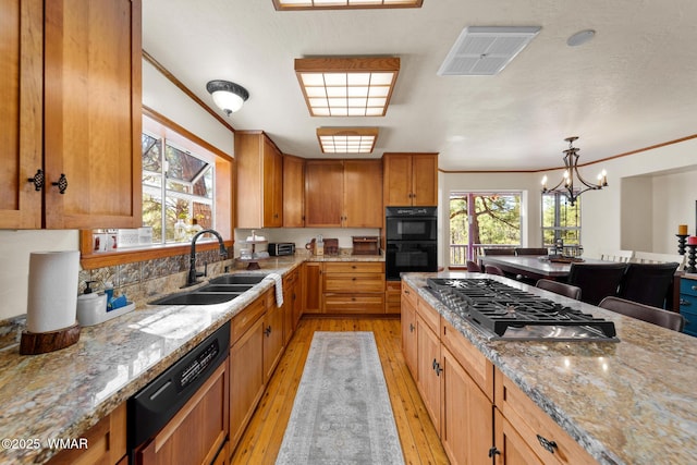 746 Jacks Wild Rd, Show Low, AZ 85901 - kitchen with dobule oven black, visible vents, paneled dishwasher, a sink, and stainless steel gas stovetop