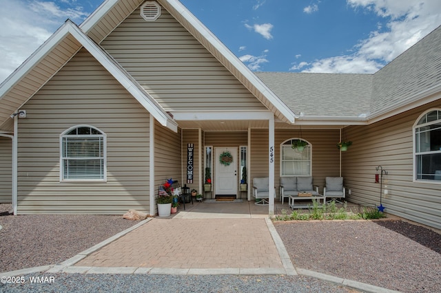 545 S 7th St, Snowflake, AZ 85937 - doorway to property featuring a porch and roof with shingles