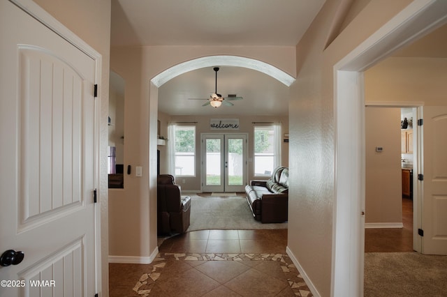545 S 7th St, Snowflake, AZ 85937 - tiled entryway featuring inlaid floor details, arched walkways, a ceiling fan, and french doors