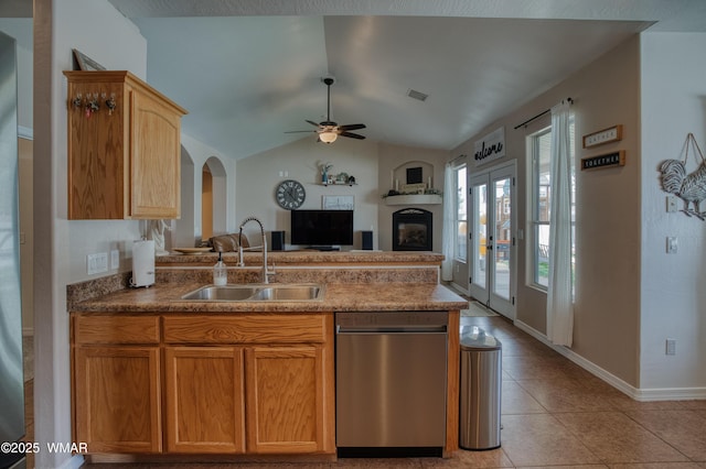 545 S 7th St, Snowflake, AZ 85937 - kitchen featuring dishwasher, a peninsula, ceiling fan, a glass covered fireplace, and open floor plan