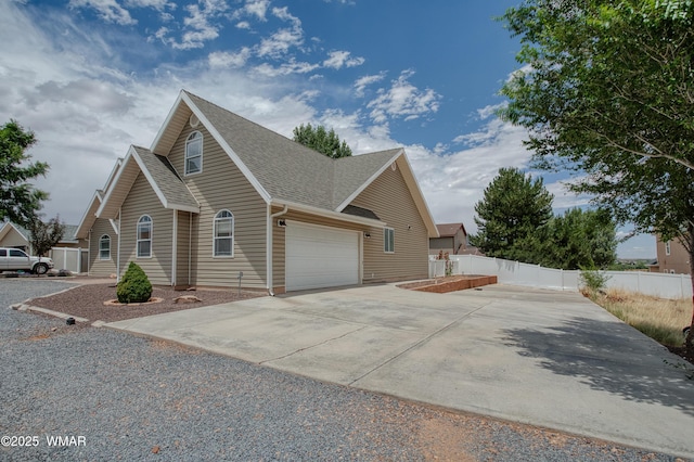 545 S 7th St, Snowflake, AZ 85937 - view of property exterior with concrete driveway, roof with shingles, and a garage