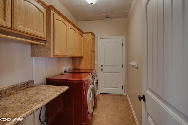 545 S 7th St, Snowflake, AZ 85937 - washroom featuring separate washer and dryer, cabinet space, and light tile patterned flooring