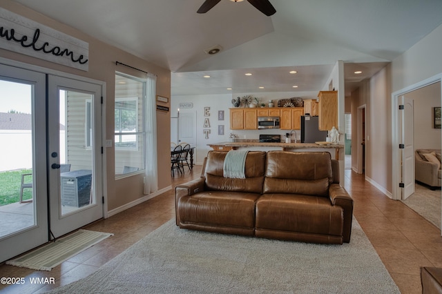 545 S 7th St, Snowflake, AZ 85937 - living room featuring light tile patterned flooring, vaulted ceiling, ceiling fan, and recessed lighting