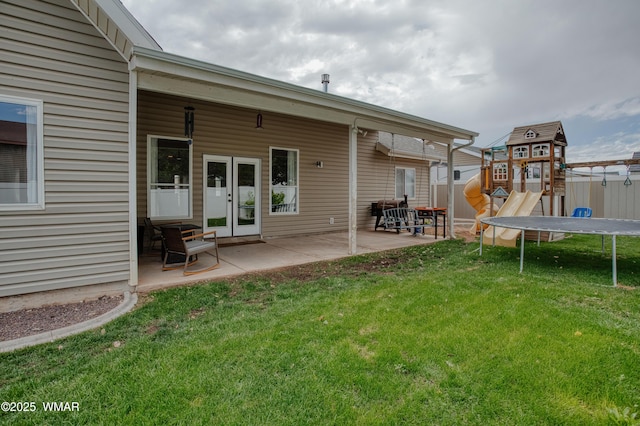 545 S 7th St, Snowflake, AZ 85937 - back of property featuring a trampoline, a patio area, and a playground