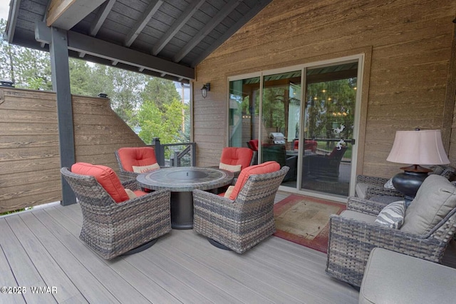 wooden terrace with outdoor dining area