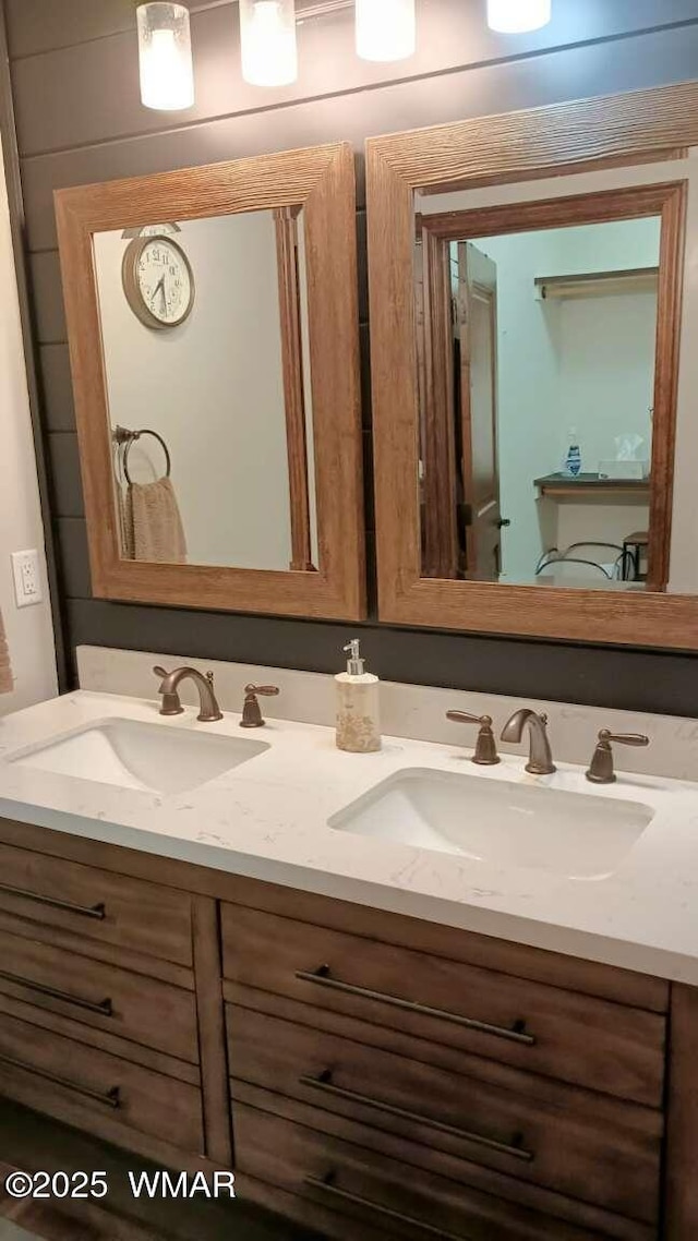 bathroom with double vanity and a sink