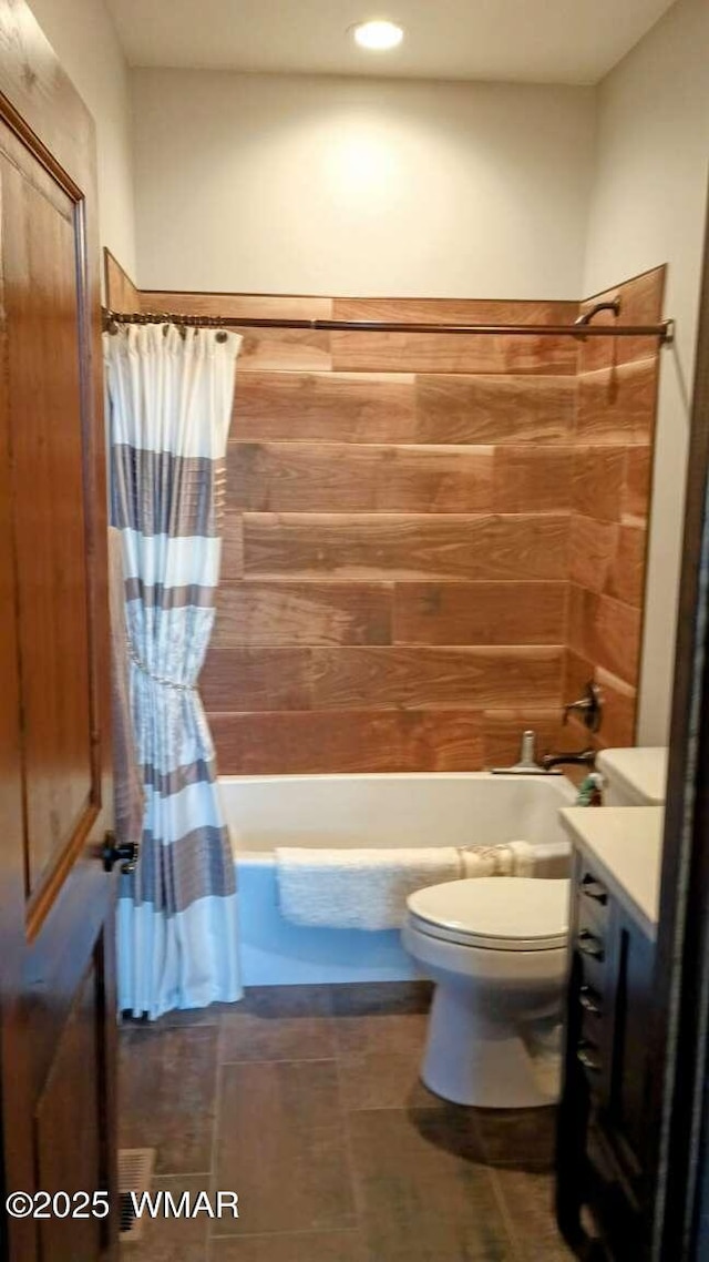 full bathroom with toilet, shower / tub combo, and vanity