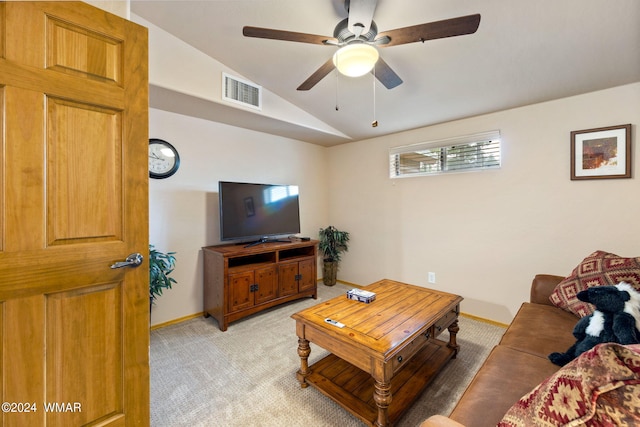 living area featuring lofted ceiling, light colored carpet, visible vents, a ceiling fan, and baseboards