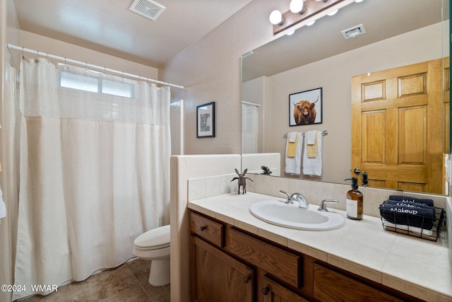 full bath featuring toilet, tile patterned floors, visible vents, and vanity