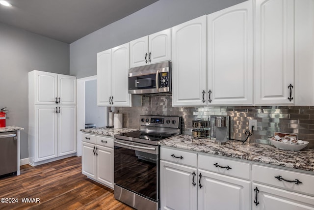 kitchen with appliances with stainless steel finishes and white cabinetry