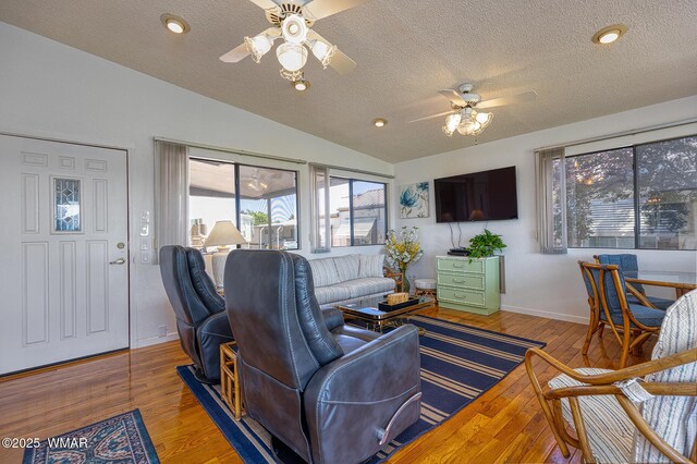 1879 Fairway Run, Show Low, AZ 85901 - living room with ceiling fan, lofted ceiling, a textured ceiling, and wood finished floors