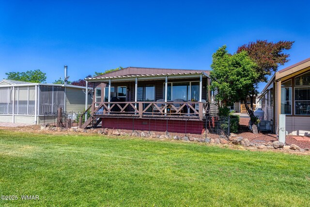 1879 Fairway Run, Show Low, AZ 85901 - view of front facade with a front lawn and a sunroom