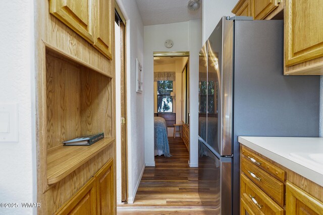 1879 Fairway Run, Show Low, AZ 85901 - kitchen featuring freestanding refrigerator, light wood-style flooring, and light countertops