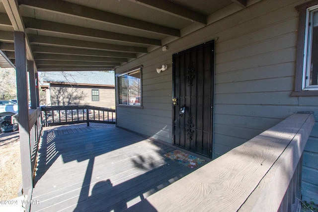 wooden deck featuring covered porch