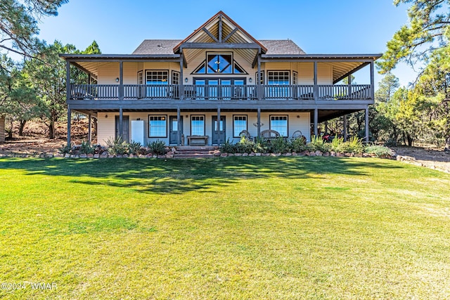 back of house with a lawn