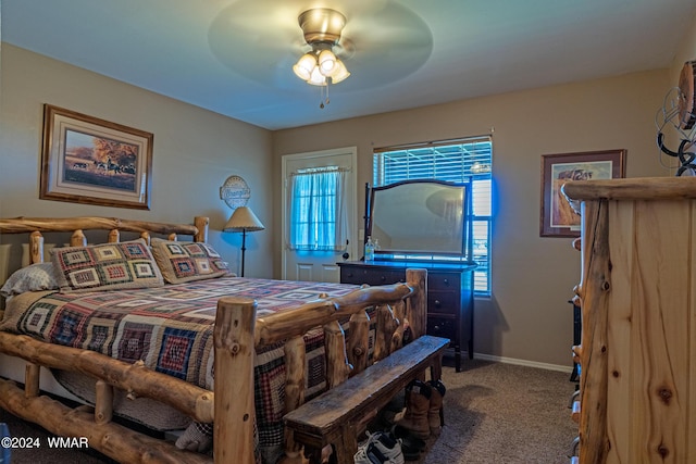 carpeted bedroom featuring a ceiling fan and baseboards