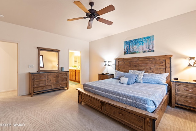 bedroom featuring light carpet, ceiling fan, connected bathroom, and baseboards