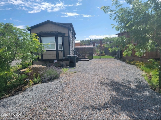 view of side of property with fence