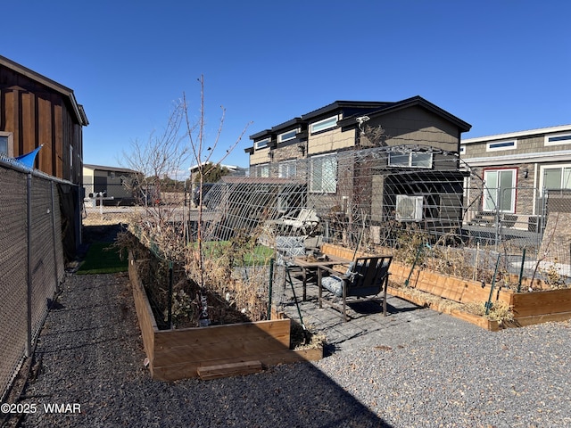 view of yard with fence and a garden