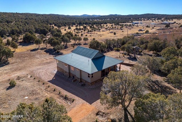 birds eye view of property featuring a mountain view