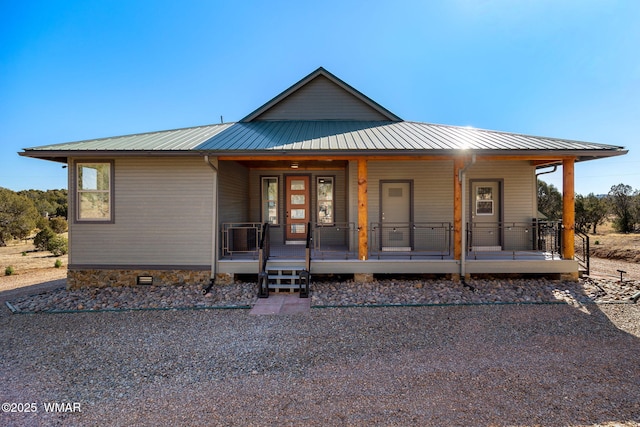 view of front of property with metal roof and a porch