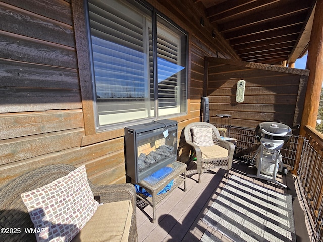 wooden deck featuring grilling area